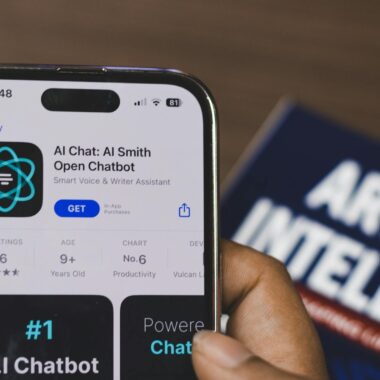 Webpage of Ai Chatbot, a prototype AI Smith Open chatbot, is seen on the website of OpenAI, on a apple smartphone. Examples, capabilities, and limitations are shown.
